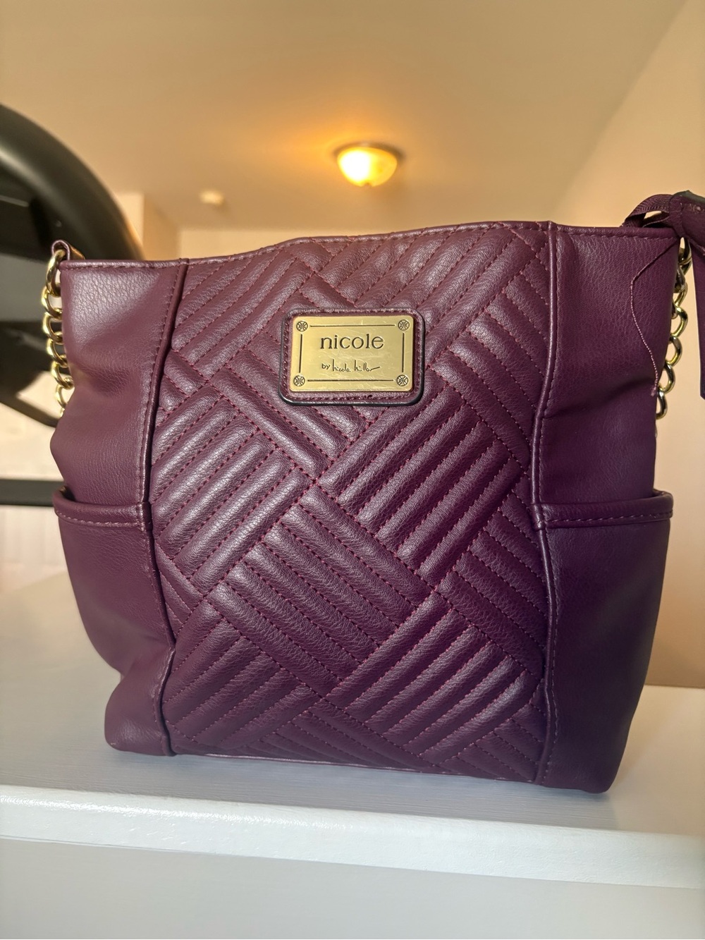 Nicole by Nicole Miller Quilted Plum Crossbody with Gold Plate